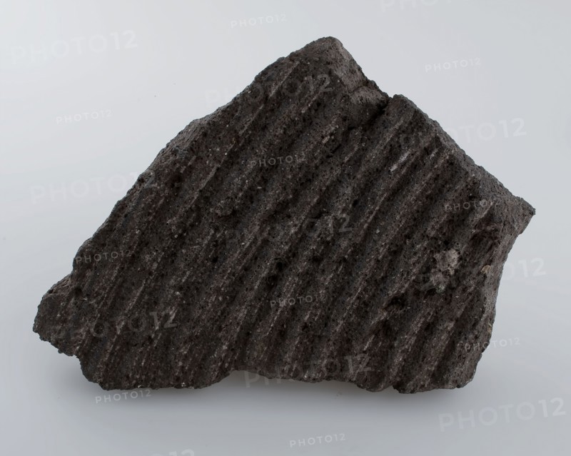 Fragment grinding stone, with circular grinding rings, millstone found in natural stone stone, split sawn chiseled Fragment
