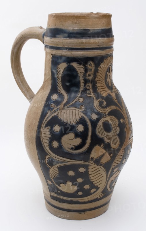 Stoneware jug be decorated with shovel clip and ear, with carved and stylized floral decor, jug crockery holder soil find
