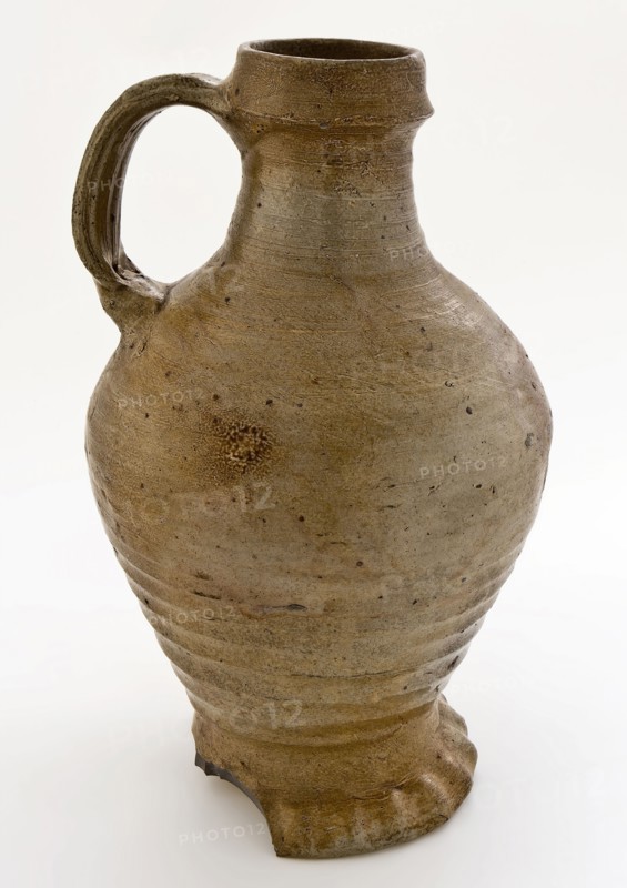 Light brown-gray stoneware jug with pinched foot, ledge around neck edge, jug crockery holder soil find ceramic stoneware clay