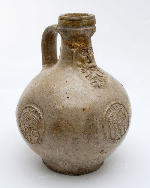 Bartmann jug, also called Bellarmine jug, gray, with mask on neck, three identical weapon medallions with date on belly
