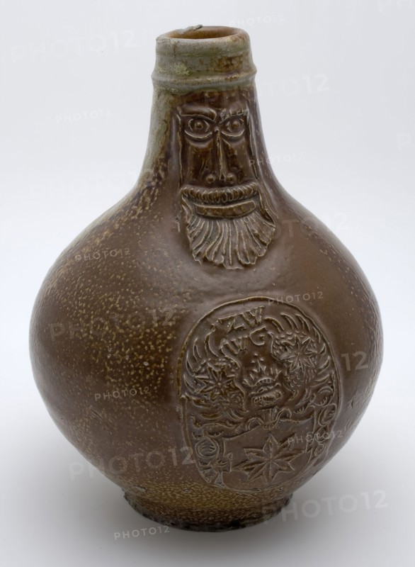 Bartmann jug, also called Bellarmine jug, on the stomach an applique with the coat of arms of Kralingen?, tableware holder soil