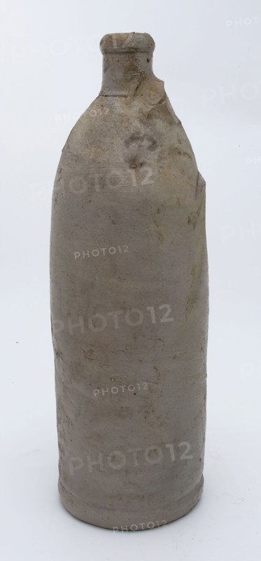 Stoneware mineral water bottle on stand surface, cylindrical, unnoticed, gray, mineral pitcher pitcher pitcher container soil