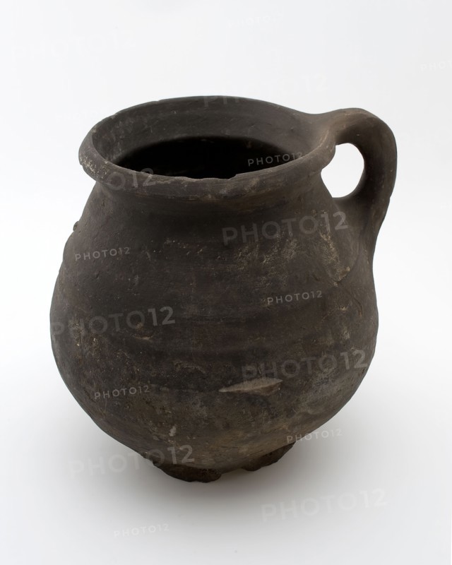 Dark-gray earthenware jug be used with coarse, twisted ears on six fins at the top, casserole can be found in the earthenware