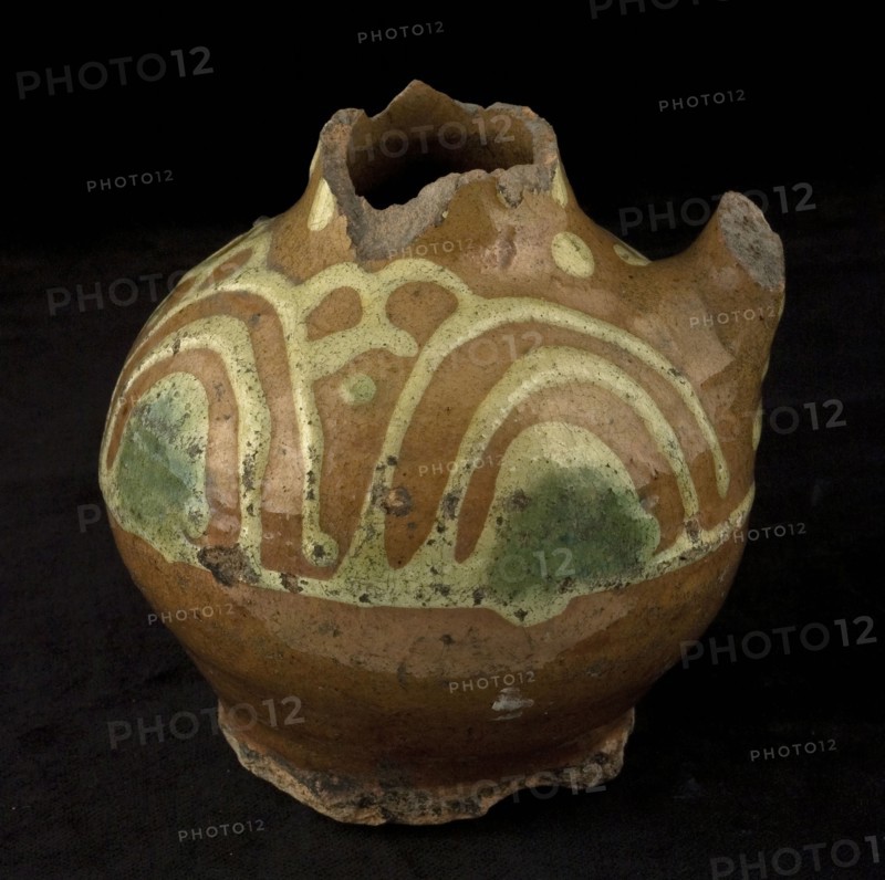 Fragment of earthenware oil jug, on stand with standing ear and sludge decoration, oil jug crockery holder soil find ceramic