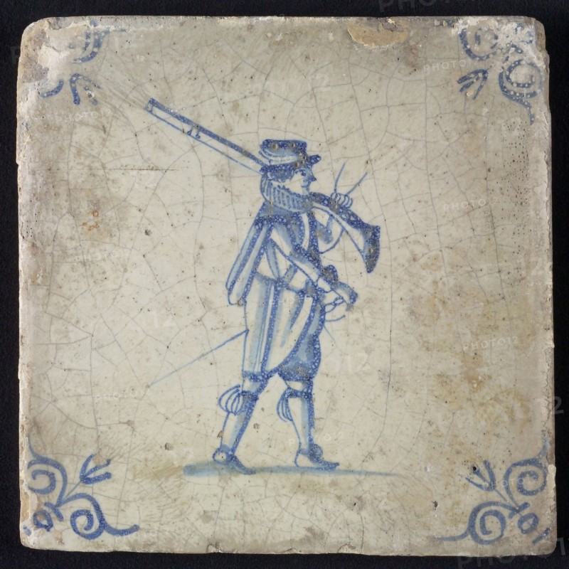 White tile with blue warrior; corner pattern ox head, wall tile tile sculpture ceramic earthenware glaze, baked 2x glazed