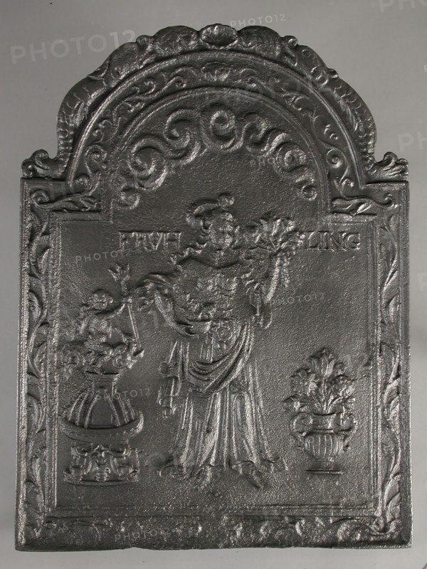 Fireplace Spring, text Frühling, fire place iron, cast Rectangular with arch at the top. On top of shell flanked by dolphins