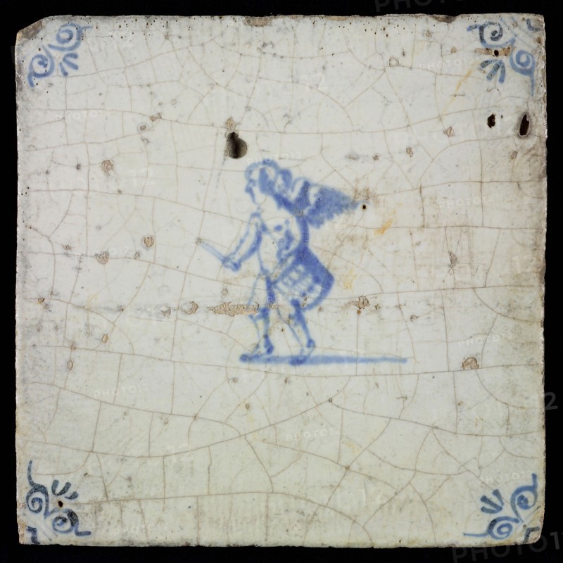White tile with blue putto with drum, ox-head in the corners, wall tile tile sculpture ceramic earthenware glaze, baked 2x