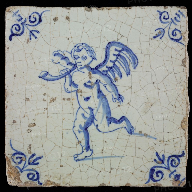 White tile with blue putto with horn, ox-head in the corners, wall tile tile sculpture ceramic earthenware glaze, baked 2x
