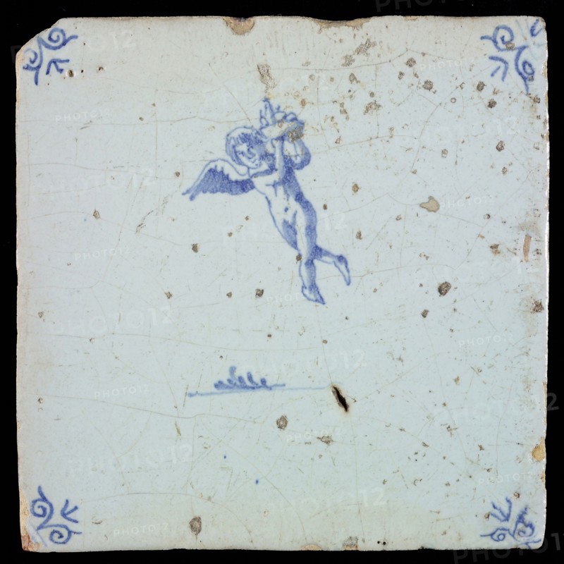 White tile with blue flying putto; corner pattern ox head, wall tile tile sculpture ceramic earthenware glaze, baked 2x glazed
