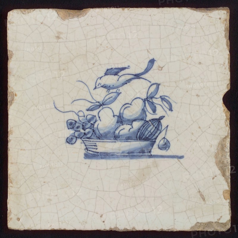 White tile with blue fruit basket with grapes and bird, wall tile tile sculpture ceramic earthenware glaze, baked 2x glazed