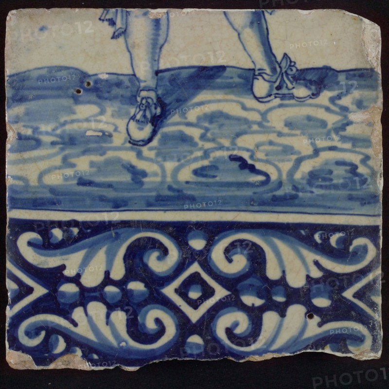 Tile of tableau with in blue feet and decorated border, tile picture footage fragment ceramics pottery glaze, baked 2x glazed