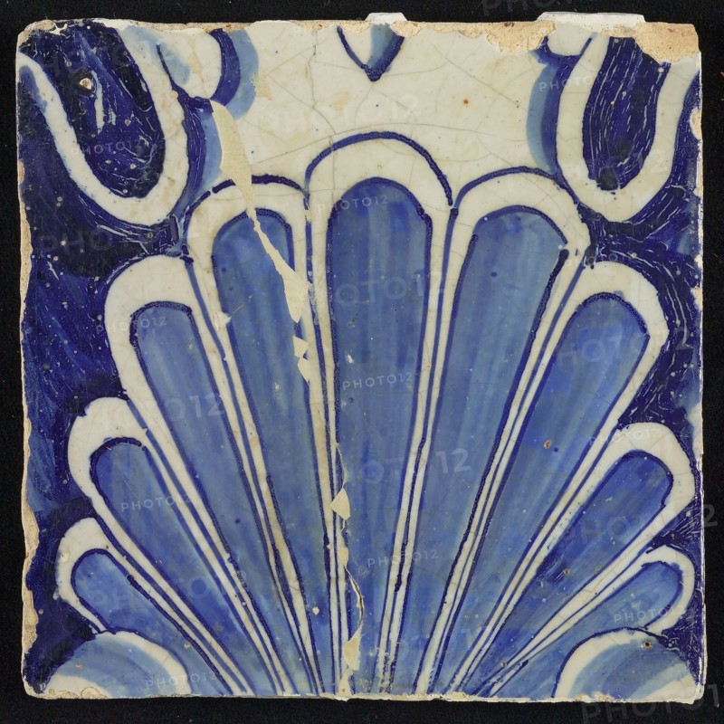 Tile of chimney pilaster, blue on white, shell-like headdress, chimney pilaster tile pilaster footage fragment ceramic