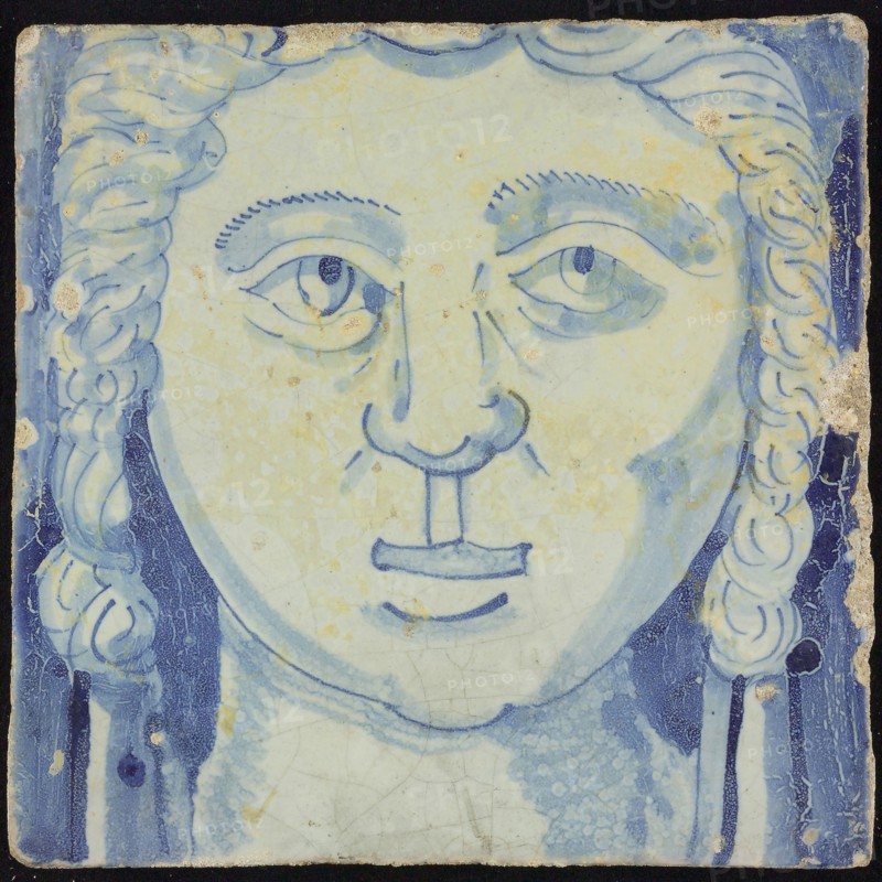 Tile of chimney pilaster, blue on white, head of woman with long curly hair, chimney pilaster tile pilaster footage fragment
