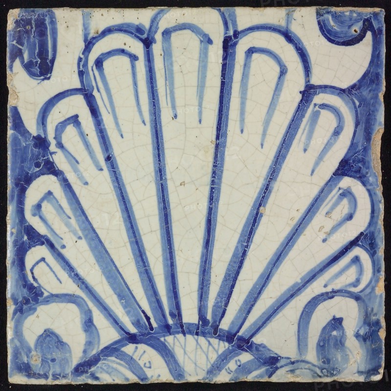 Tile of chimney pilaster, blue on white, shell-like headdress in white, chimney pilaster tile pilaster footage fragment ceramic