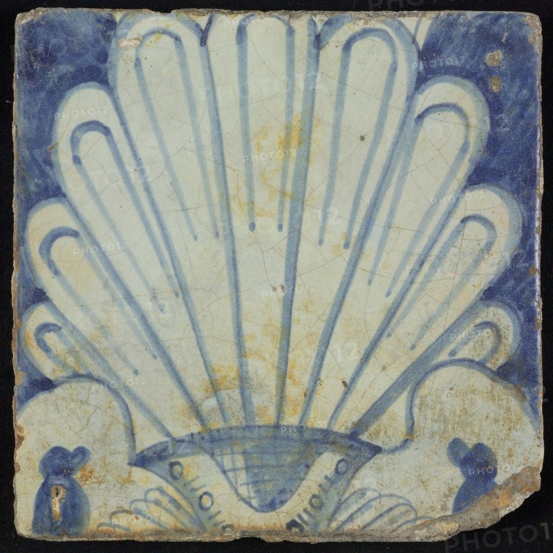 Tile of chimney pilaster, blue on white, shell-like headdress in white, chimney pilaster tile pilaster footage fragment ceramic