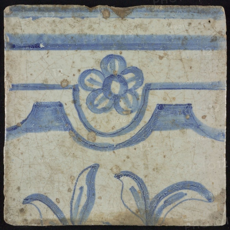 Tile of chimney pilaster, blue on white, horizontal border with scallop and five-leaved flower, rosette, underneath two