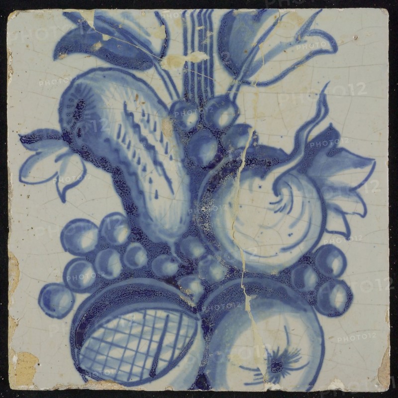 Tile of chimney pilaster, blue on white, part of up and down continuous representation with fruits, including pomegranate