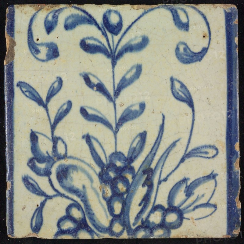 Tile of chimney pilaster, blue on white, part of up and down continuous representation with fruits and branches, chimney