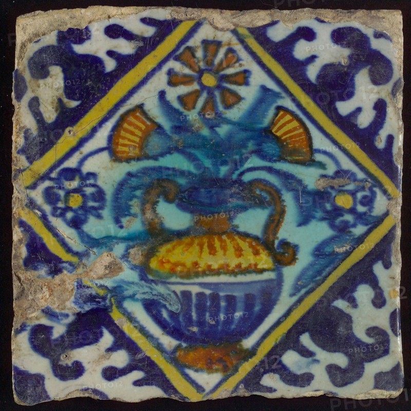 Tile, orange, brown, green, and blue on white, flowerpot in square, corner pattern palmet, wall tile tile sculpture ceramic