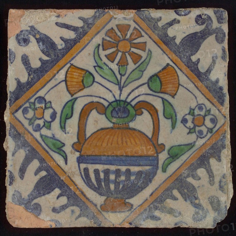 Tile, orange, brown, green, and blue on white, flowerpot in square, corner pattern palmet, wall tile tile sculpture ceramic