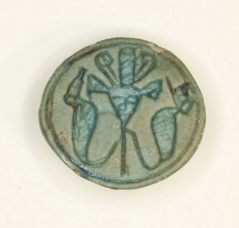 Cowroid: Head of Hathor Flanked by Uraeui, New Kingdom, Dynasty 18 (about 1550–1295 BC), Egyptian, Egypt, Steatite, H. 0.6 cm ( 1/4 in.), diam. 1.4 cm (9/16 in.)