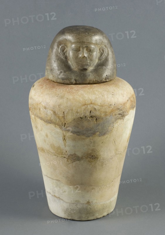 Canopic Jar with Human Head Lid, Middle Kingdom, Dynasty 12 (about 1985–1773 BC), Egyptian, Egypt, Stone, a (jar):  24.7 × 17.3 × 17.7 cm (9 ¾ × 7 × 7 in)
