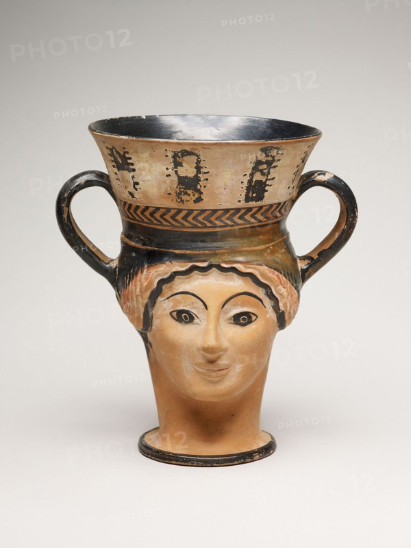 Kantharos (Wine Cup) in the Shape of a Female Head, about 480 BC, Greek, Athens, Attributed to the London Class (Class G), Athens, terracotta, white-ground and black-figure technique, 19 × 17.8 × 13.3 cm (7 1/2 × 7 × 5 1/4 in.)