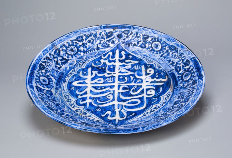 Dish, Qajar dynasty (1796–1925), dated 1822/1823 A.D., Iran, Iran, Fritware, painted in blue under a transparent glaze, H. 4.6 cm (1 13/16 in.),  Diam. 28 cm (11 1/16 in.)