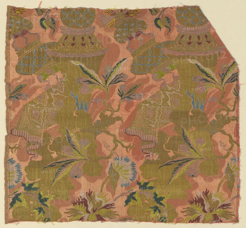 Fragment, c. 1705/06, France, Silk, gilt-and-silvered-metal-strip-wrapped silk, warp-float faced 7:1 satin weave with supplementary patterning wefts, supplementary brocading wefts, and self-patterned by areas of plain weave, 47.9 × 51.7 cm (18 7/8 × 20 3/8 in.)