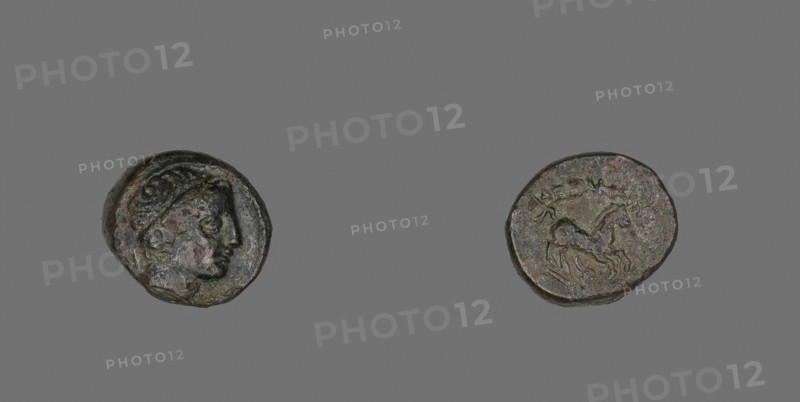 Coin Depicting the God Apollo (?), 336/323 BC, Greek, Greece, Bronze, Diam. 1.7 cm, 4.15 g