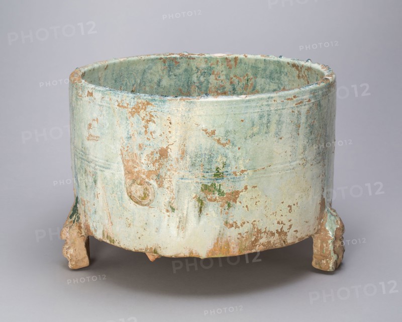 Tripod Cylindrical Jar (Lian or Zun), Eastern Han dynasty (25–220 A.D.), 2nd century, China, Earthenware with green lead glaze, H. 22.0 cm (8 11/16 in.), diam. 31.1 cm (12 1/4 in.)