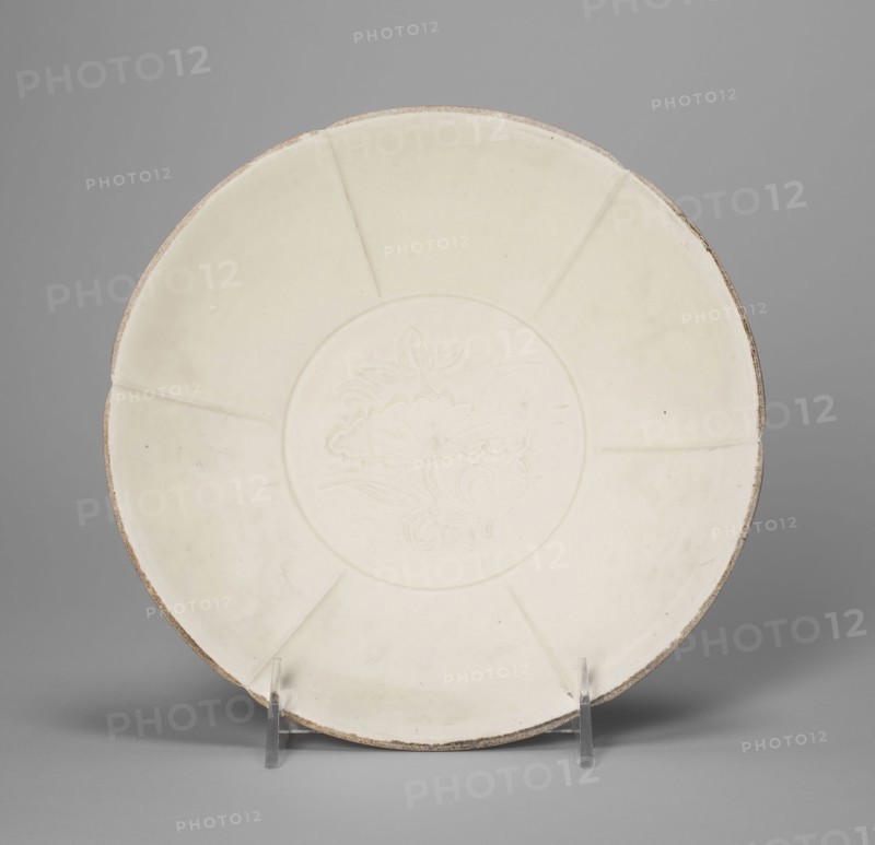 Shallow Lobed Bowl with Peony Scroll, Northern Song dynasty (960–1127), 11th century, China, Ding ware, porcelain with underglaze carved decoration, H. 4.5 cm (1 3/4 in.), diam. 20.9 cm (8 1/4 in.)