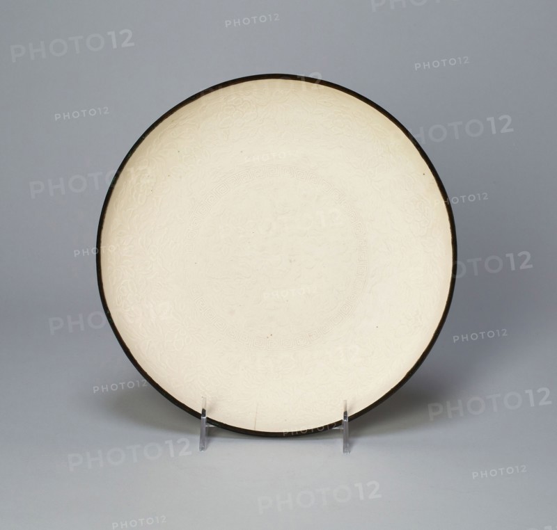 Dish with with Lotus, Saggataria, Mallow, and Peony, Northern Song dynasty (960–1127)/Jin dynasty (1115–1234), early 12th century, China, Ding ware, porcelain with underglaze mold-impressed decoration, H. 4.7 cm (1 7/8 in.), diam. 24.5 cm (9 5/8 in.)