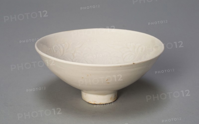 Conical Bowl with Peonies and Leaves, Song dynasty (960–1279), China, Ding ware, porcelain with underglaze molded decoration, H. 4.7 cm (1 7/8 in.), diam. 10.3 cm (4 1/16 in.)