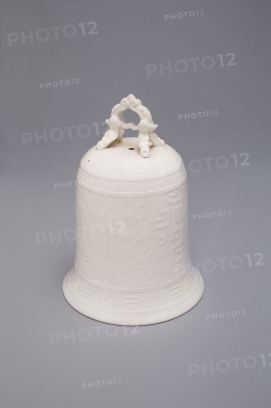 Bell with Archaistic Motifs, Qing dynasty (1644–1911), mid–17th century, China, Dehua ware (blanc de chine), porcelain with underglaze mold-impressed decoration, H. 16.4 cm (6 1/2 in.), diam. 2.0 cm (4 3/4 in.)