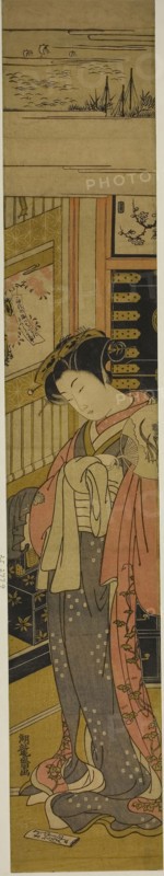 The Courtesan Kaoru of Chojiya Looking Down at a Love Letter on the Floor, c. 1773/75, Isoda Koryusai, Japanese, 1735-1790, Japan, Color woodblock print, hashira-e, 26 3/8 x 4 5/8 in.