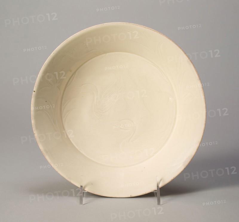 Dish with Ducks and Water Plants, Northern Song dynasty (960–1127), early 11th century, China, Ding ware, porcelain with underglaze carved and incised decoration, H. 5.1 cm (2 in.), diam. 21.6 cm (8 1/2 in.)
