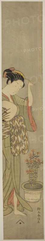 Beauty Adjusting Her Hairpin, c. 1768/69, Suzuki Harunobu ?? ??, Japanese, 1725 (?)-1770, Japan, Color woodblock print, hashira-e, 64.5 x 11.4 cm (26 3/8 x 4 1/2 in.)