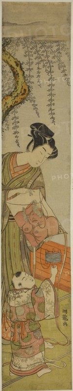 Young Man Holds a Kite for a Child, c. 1774, Isoda Koryusai, Japanese, 1735-1790, Japan, Color woodblock print, hashira-e, 26 1/8 x 4 5/8 in.