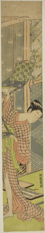Young Woman Hanging a Painting, c. 1771, Isoda Koryusai, Japanese, 1735-1790, Japan, Color woodblock print, hashira-e
