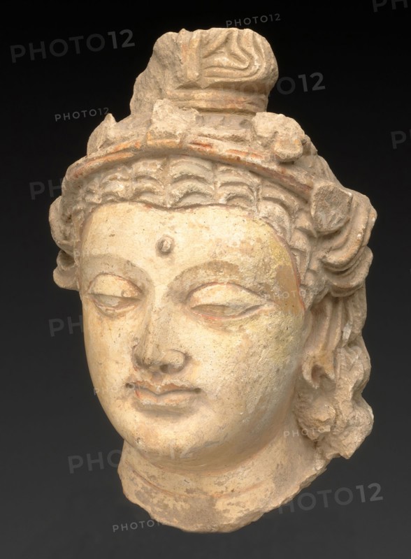 Head of a Bodhisattva, Kushan period, About 3rd/5th century, Present-day Afghanistan or Pakistan, Ancient region of Gandhara, Gandhara, Stucco with traces of red pigment, 20.4 × 13.5 × 10.8 cm (8 × 5 5/16 × 4 1/4 in.)
