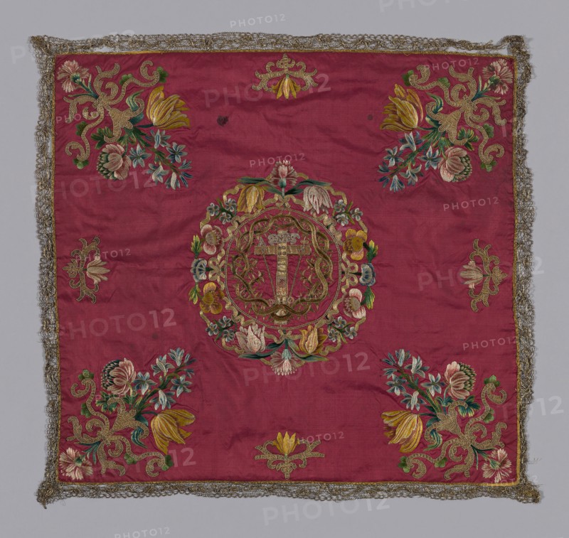 Chalice Cover, 18th century, Italy, Silk, warp-faced plain weave, same lining, edged with bobbin lace of metal thread, embroidered in silk floss, gold metal strip wrapped on silk core—used singly and as 2-ply twist, metal strip, stitches: long and short, couching, stem, knot, herring-bone (threaded with metal strip) couching in brick and other patterns, 69.2 x 72.5 cm (27 1/4 x 28 1/2 in.)