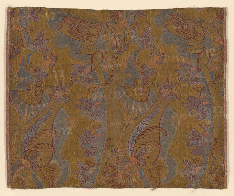 Panel (Dress Fabric), c. 1711, France or England, France, Silk and gilt-metal-strip-wrapped silk, warp-float faced 7:1 satin weave with supplementary binding warps tying supplementary brocading wefts and self-patterning ground wefts in 3:1 and 2:2 twill interlacings, 44.7 × 54.2 cm (17 5/8 × 21 3/8 in.)