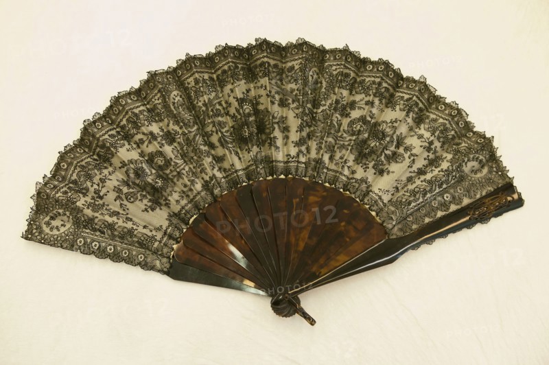 Fan, 1860/70, France, Silk, bobbin straight lace backed by silk 7:1, satin weave, lined with silk, plain weave, tortoise shell guards, sticks, rivet and loop, black on white, 28.6 × 50.7 cm (11 1/4 × 20 in.)