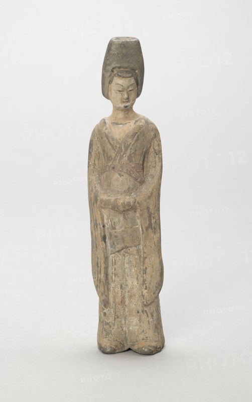 Standing Attendant, Style of Nothern Wei, early 6th century, China, Shanxi, Earthenware with traces of polychrome pigment, 18.0 x 4.3 x 3.5 cm (7 1/16 x 1 11/6 x 1 3/8 in.)