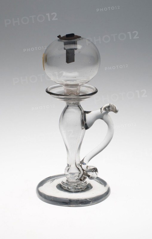 Lamp, c. 1820, England, Glass, clear, baluster stem, spherical font, with S-scroll handle and metal wick holder, 21 × 9.5 cm (8 1/4 × 3 3/4 in.)