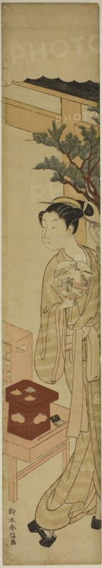 The Waitress Osen of the Kagiya Teahouse Holding a Fan, c. 1768/69, Suzuki Harunobu ?? ??, Japanese, 1725 (?)-1770, Japan, Color woodblock print, hashira-e, 25 5/16 x 4 3/4 in.