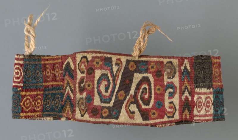 Headband, A.D. 600/900, Wari, Probably central or south coast, Peru, Peru, Cotton and wool (camelid), bands of single interlocking tapestry weave, plain weave, and two-color complementary weft weave, attached cotton tassels, 13.0 x 23.7 cm (5 1/8 x 9 3/8 in.)