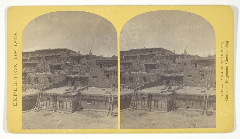 Indian Pueblo of Zuni, New Mexico, view from the interior. The Pueblo or town, encloses a quadrangular area within which are the ruins of a church built under the direction of the Jesuit missionaries. The houses are built one above the other to the height of five or six stories. The entrances are mostly from the top, the ascent and descent being made by ladders, 1873, Timothy O’Sullivan (American, born Ireland, 1840–1882), commissioned by George Wheeler for the War Department, Corps of Engineers, U.S. Army, United States, Albumen print, stereo, No. 16 from the series "Geographical Explorations and Surveys West of the 100th Meridian