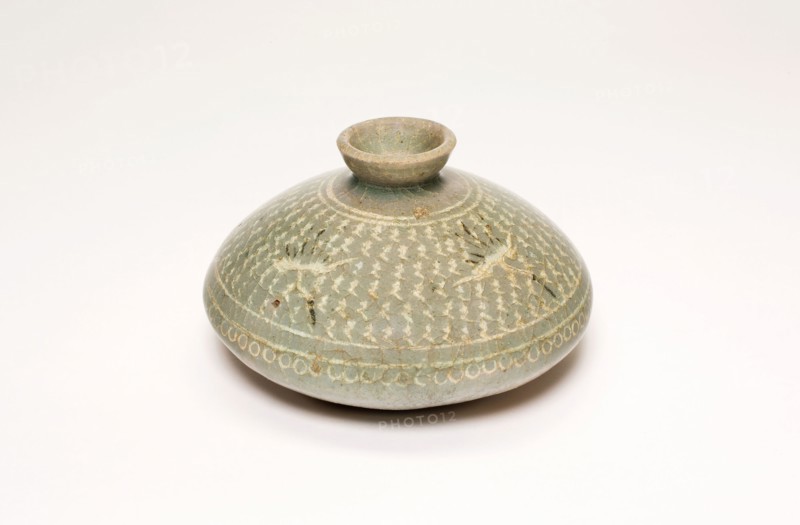 Oil Bottle with Cranes and Stylized Clouds, Goryeo dynasty (918–1392), late 13th century, Korea, Korea, Celadon-glazed stoneware with underglaze inlaid decoration of black and white clays, H. 5.4 cm (2 1/8 in.), diam. 8.6 cm (3 3/8 in.)